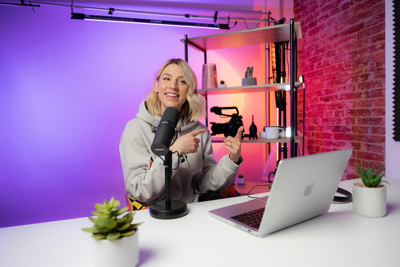 Video content creator filming in a studio setup
